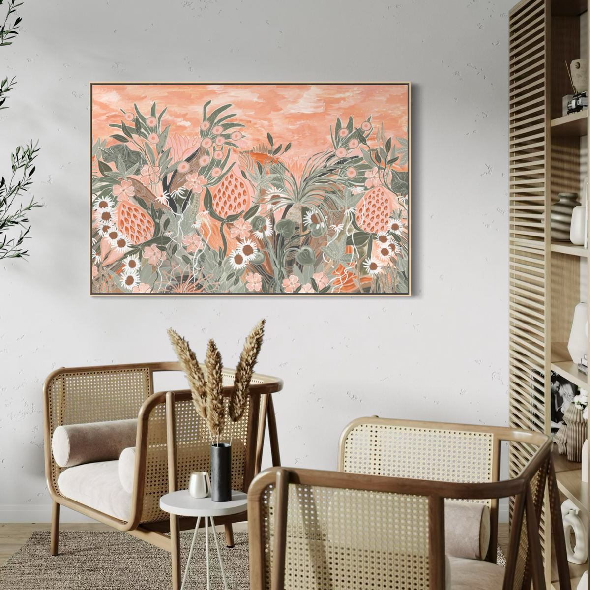 Evening Primrose Rectangle by Anna Lohe – framed artwork of banksias and native flowers under an apricot sky, in a living room with cane chairs