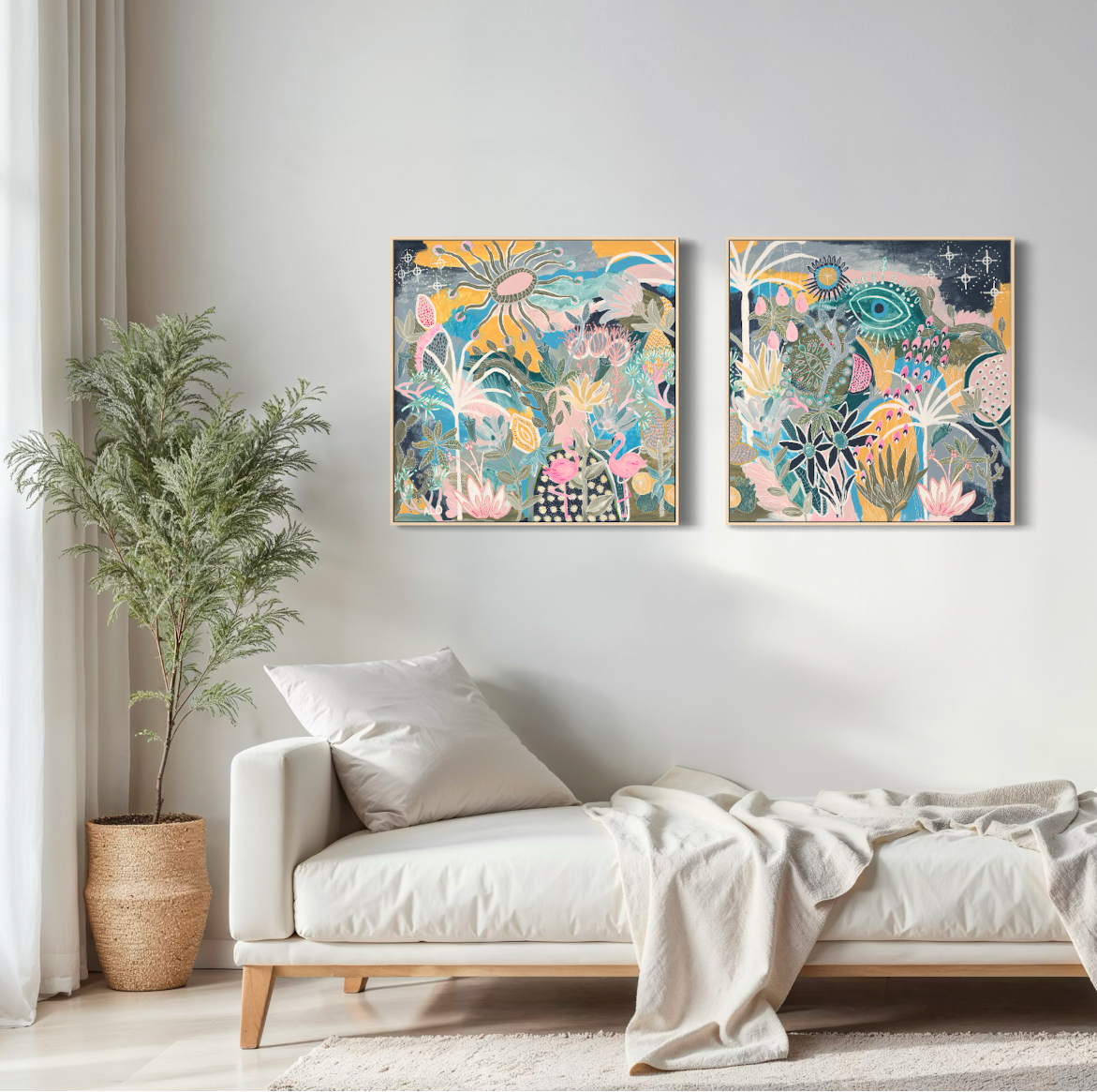 Two colorful abstract paintings on a wall above a white sofa with a plant to the left.