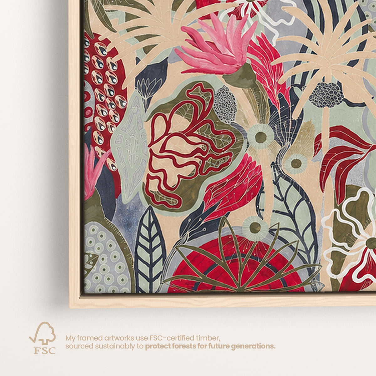 Framed botanical art print featuring an abstract floral and leafy design in red, pink, sage green, beige, and gray tones, shown in a light wood frame against a white background with an FSC certification note below.
