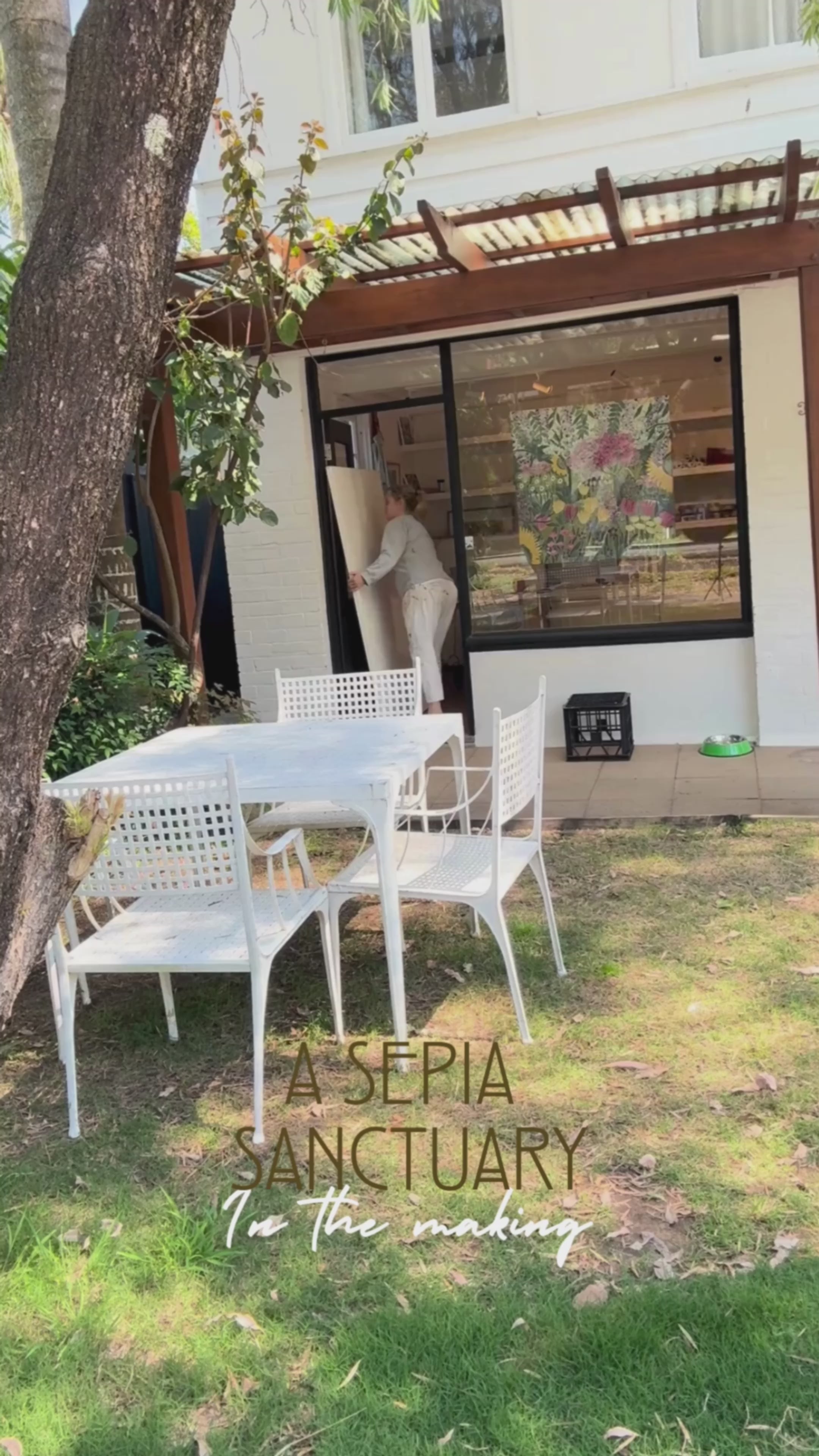Video showing Anna Lohe painting her large artwork called "A Sepia Sanctuary"
