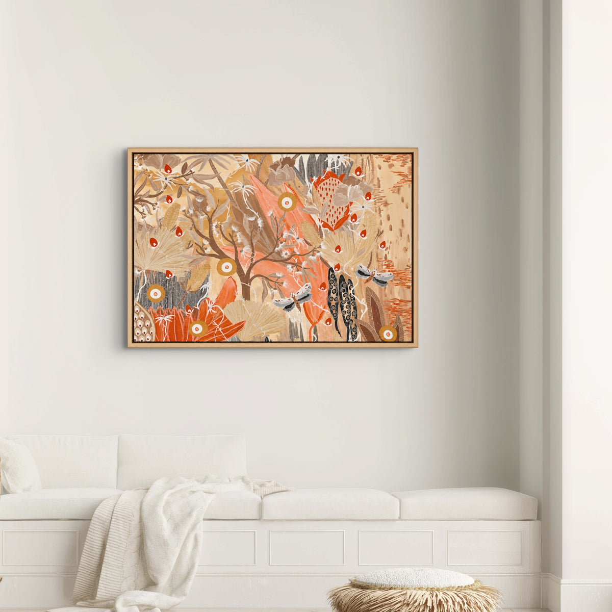 Scribbly Gum Landscape by Anna Lohe – framed horizontal artwork in terracotta, wheat, gold and charcoal above a white sofa in a living room