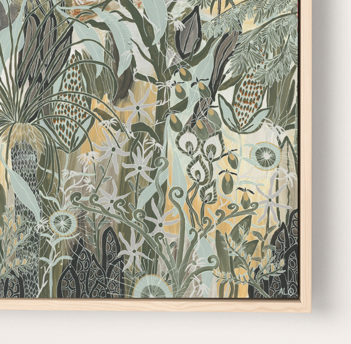 A framed botanical art print featuring an intricate pattern of stylized plants and flowers in muted green, sage, cream, and mustard tones, housed in a light natural wood frame against a clean white wall.