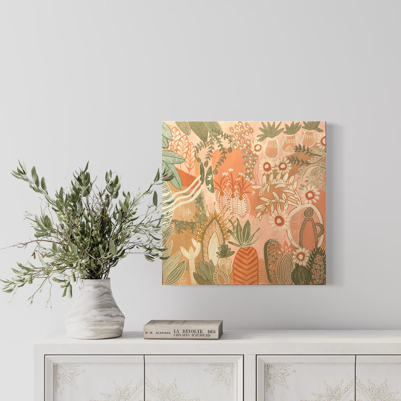 Painting by Anna Lohe on wall called Aperol Sunset. Colour palette is peach, terracotta and features botanical imagery